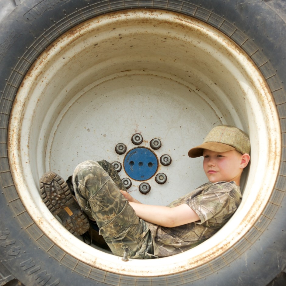 Neil in a tractor wheel