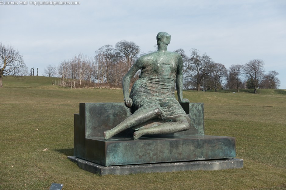 Draped Seated Woman, 1957-58 This is one of the more directly figurative works in the exhibition. To quote Moore: :Some people have said why do I make the heads so unimportant. Actually, for me the head is the most important part of a piece of sculpture. It gives to the rest a scale, it gives to the rest a certain human poise and meaning, and it's because I think the head is so important that I often reduce it in size to make the rest more monumental". He f=goes on to remind us that Michelangelo did exactly the same thing.